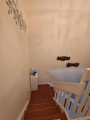 a view of a hallway with staircase