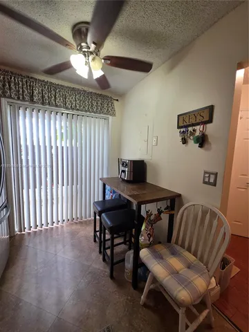 a workspace with furniture and a chandelier