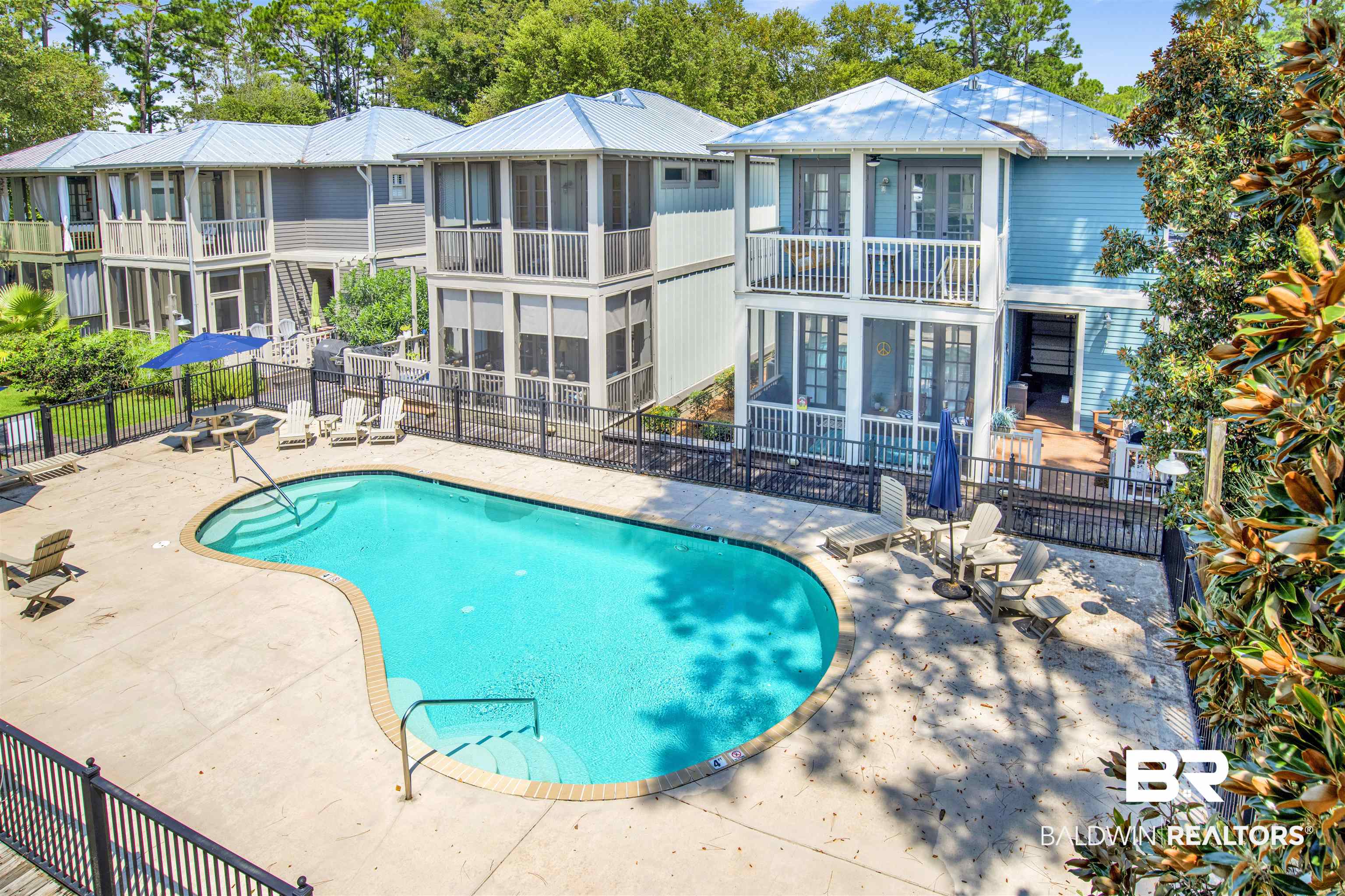 25773 Canal Road, Unit 38 Orange Beach, AL 36561 - Photo 34 of 38 View of pool with a patio and a sunroom