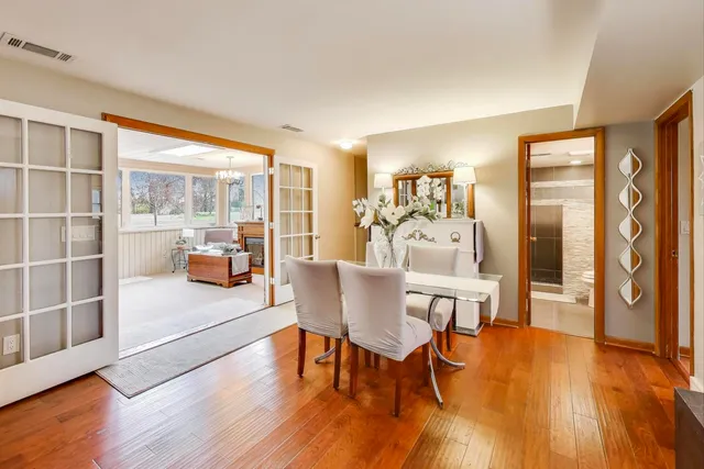 a view of a dining room with furniture and wooden floor