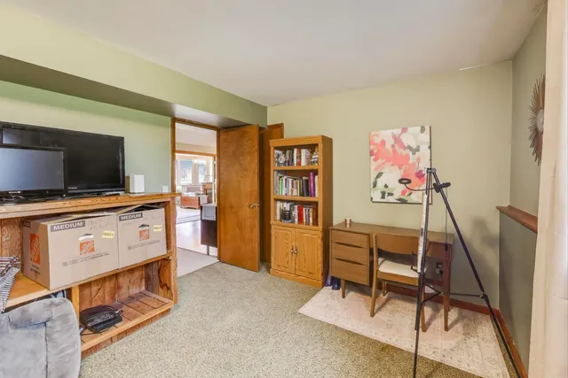 a room with furniture and flat screen tv