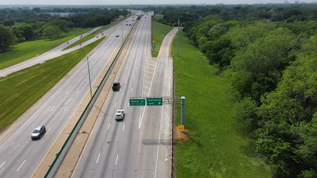 a view of a balcony with yard