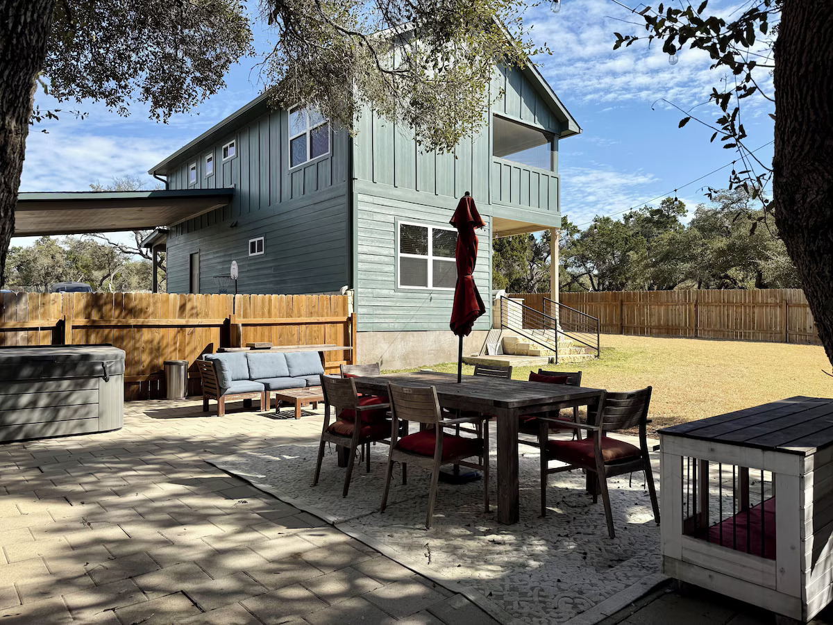11605 Fitzhugh Road Austin, TX 78736 - Photo 3 of 24 a view of a patio with a table and chairs