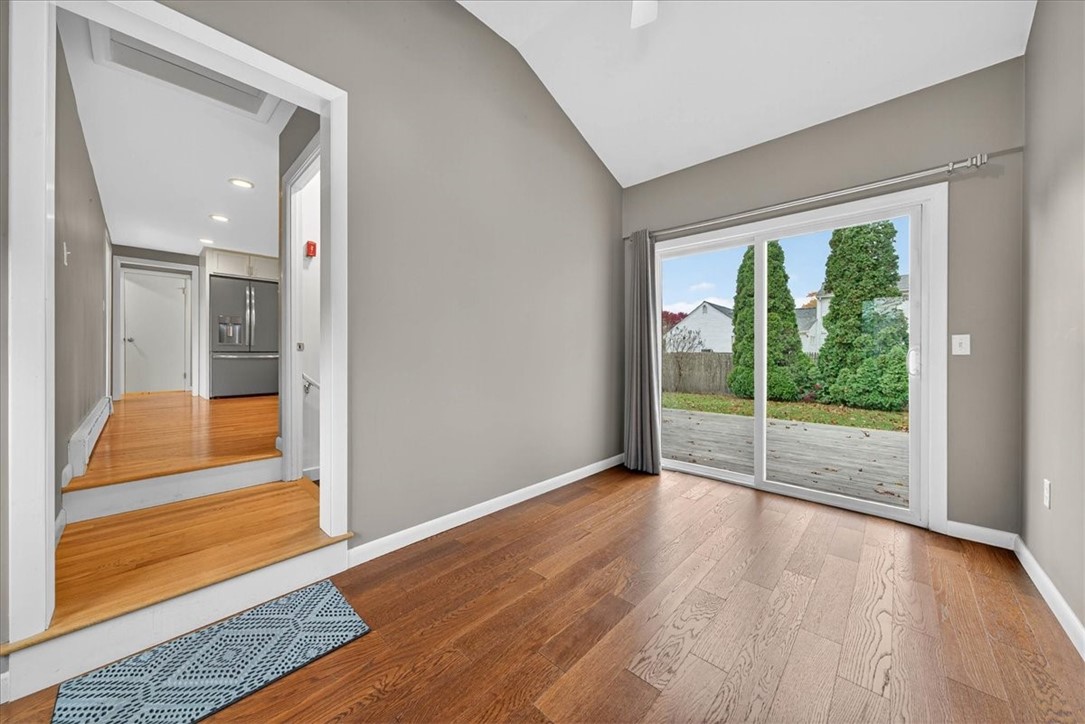 45 Hamden Road Cranston, RI 02920 - Photo 5 of 43 Enter of the driveway into this spacious room with a vaulted ceiling and large slider out to the patio/deck and pretty backyard. Off to the right is the garage and to the left steps into the kitchen area (and finished basement off to the right).