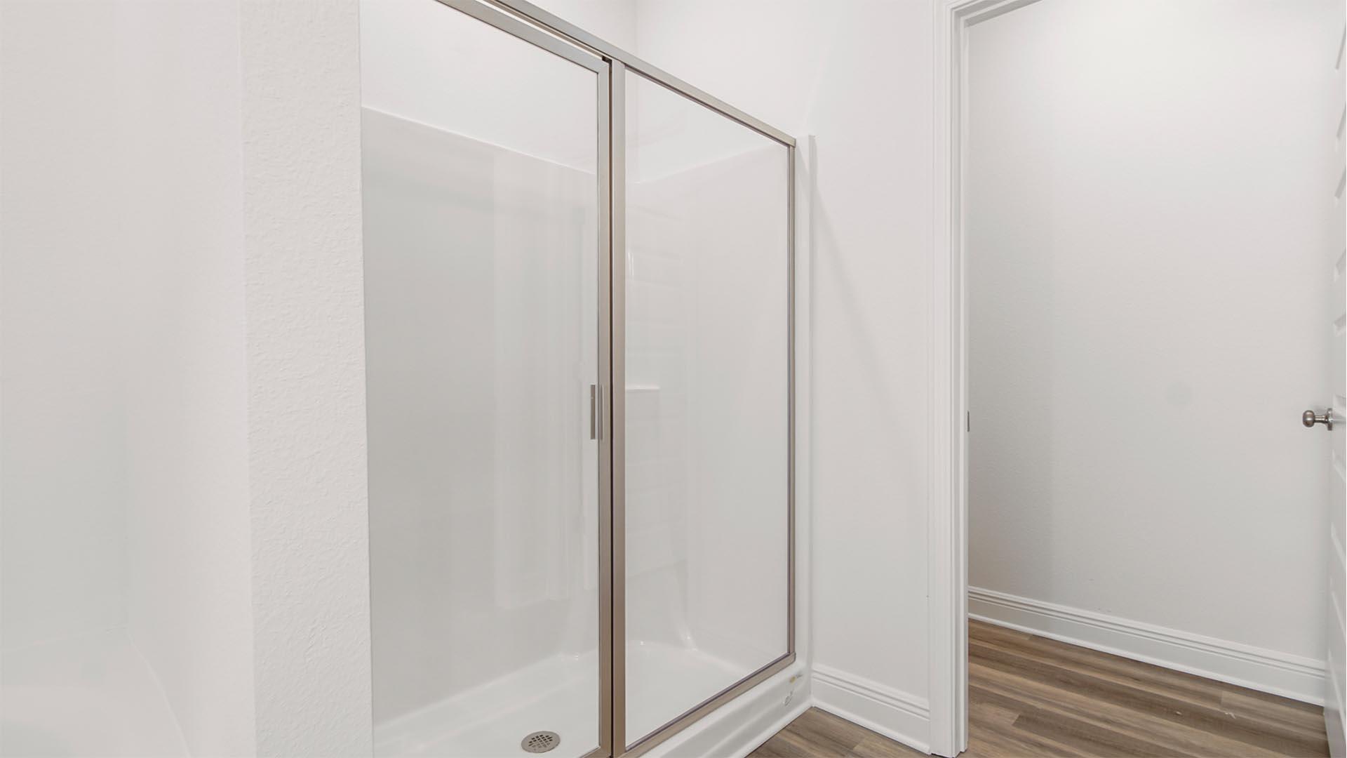 50 Foxtrail Run Freeport, FL 32439 - Photo 13 of 17 a bathroom with a glass shower door