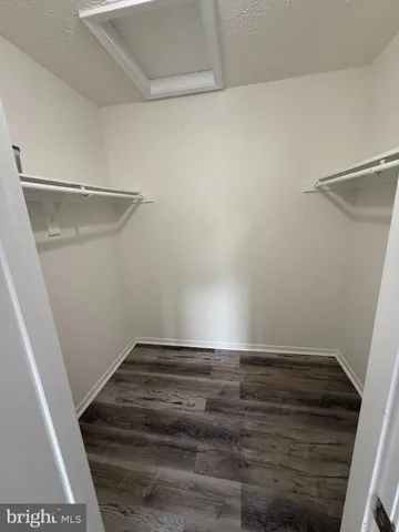 a view of an empty walk in closet