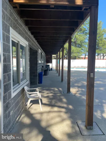 a view of swimming pool with outdoor seating