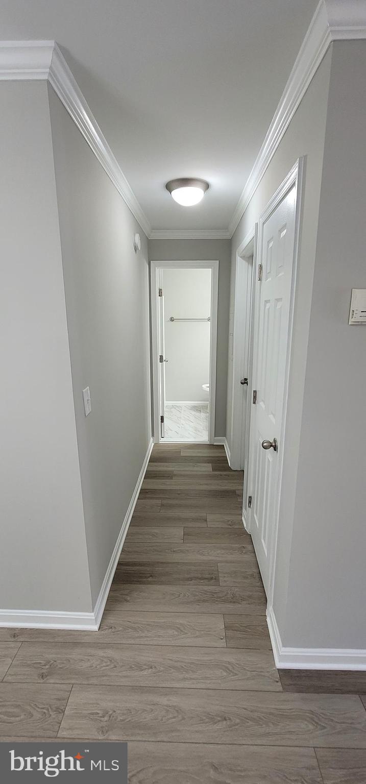 14905 Rydell Road, Unit 204 Centreville, VA 20121 - Photo 13 of 18 Hallway - Waterheater Closet, Bedroom, & Bathroom