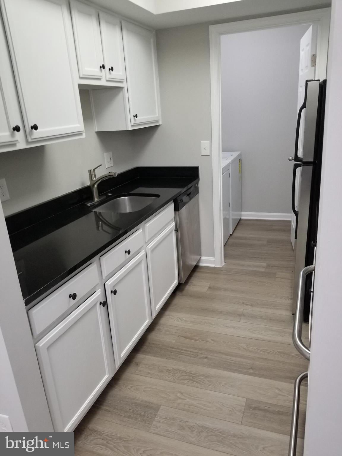 14905 Rydell Road, Unit 204 Centreville, VA 20121 - Photo 7 of 18 Kitchen.1 - Left side view and Laundry Room