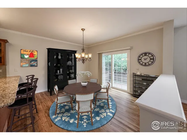 a kitchen with stainless steel appliances granite countertop a sink refrigerator and cabinets
