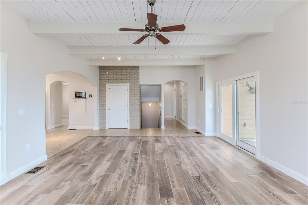3073 Gulf Winds Circle Hernando Beach, FL 34607 - Photo 11 of 95 a view of empty room with wooden floor
