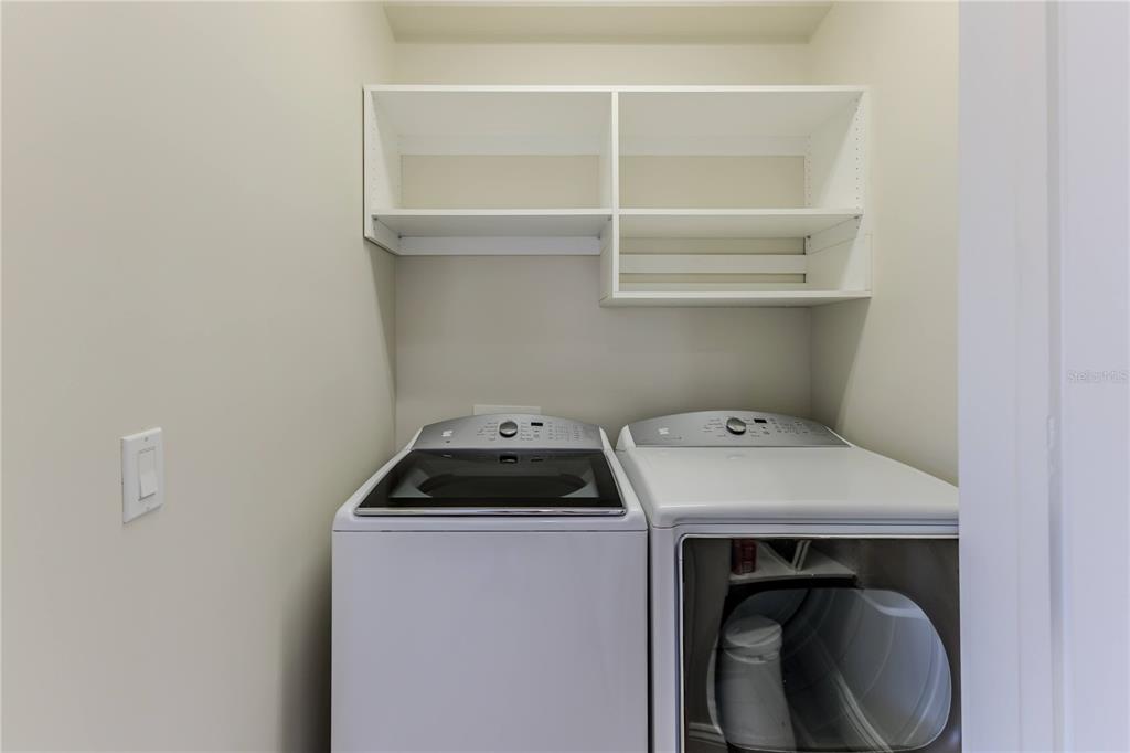 3073 Gulf Winds Circle Hernando Beach, FL 34607 - Photo 20 of 95 a utility room with dryer and washer