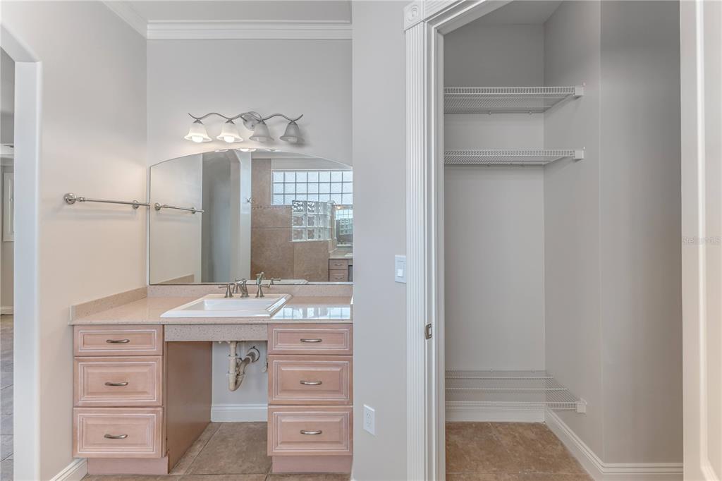 3073 Gulf Winds Circle Hernando Beach, FL 34607 - Photo 36 of 95 a bathroom with a sink vanity and a mirror