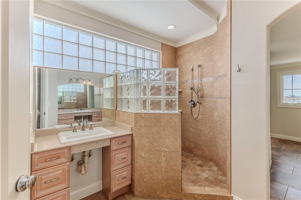 3073 Gulf Winds Circle Hernando Beach, FL 34607 - Photo 37 of 95 a bathroom with a shower sink and mirror