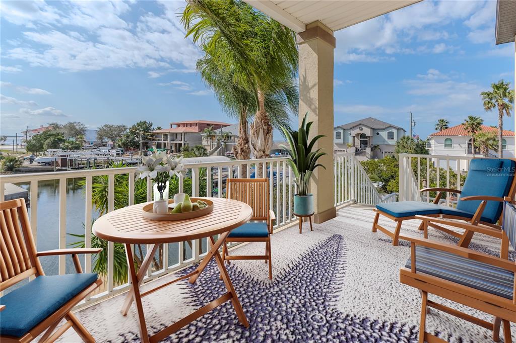 3073 Gulf Winds Circle Hernando Beach, FL 34607 - Photo 43 of 95 a balcony with furniture and a potted plant