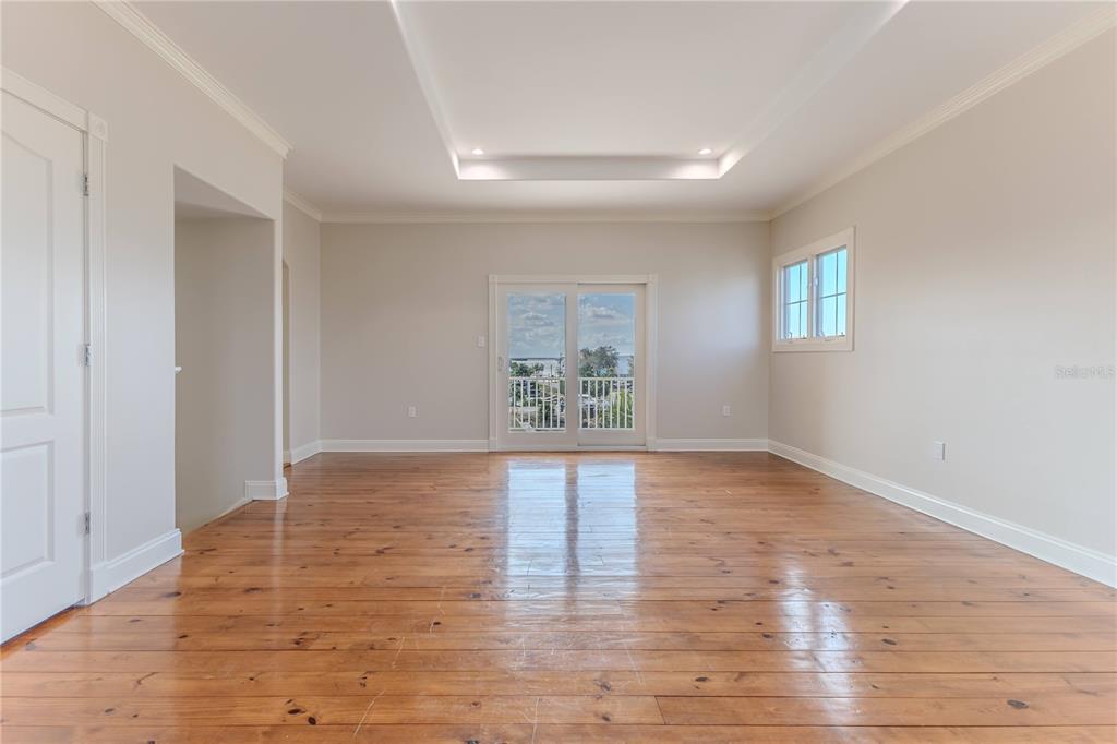 3073 Gulf Winds Circle Hernando Beach, FL 34607 - Photo 45 of 95 a view of an empty room with wooden floor and a window
