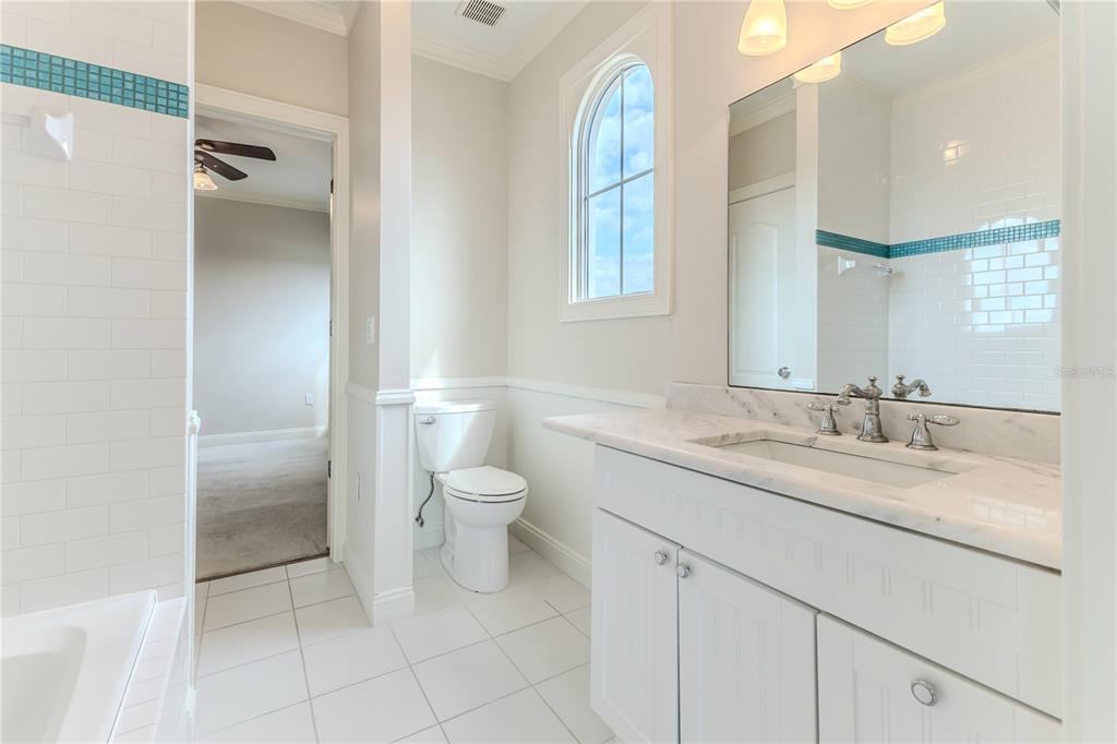 3073 Gulf Winds Circle Hernando Beach, FL 34607 - Photo 60 of 95 a bathroom with a granite countertop sink mirror and toilet