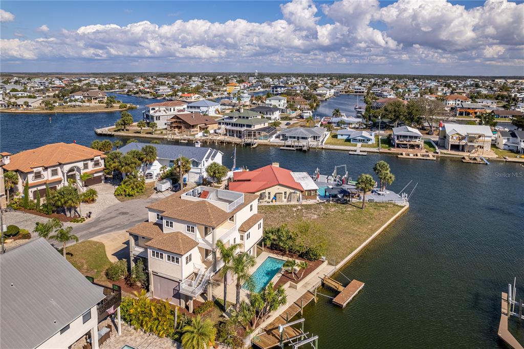 3073 Gulf Winds Circle Hernando Beach, FL 34607 - Photo 62 of 95 an aerial view of residential houses with outdoor space