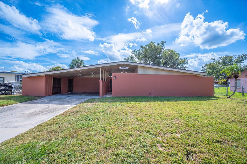 2214 Nottingham Road Lakeland, FL 33803 - Photo 1 of 40 a view of a backyard with potted plants