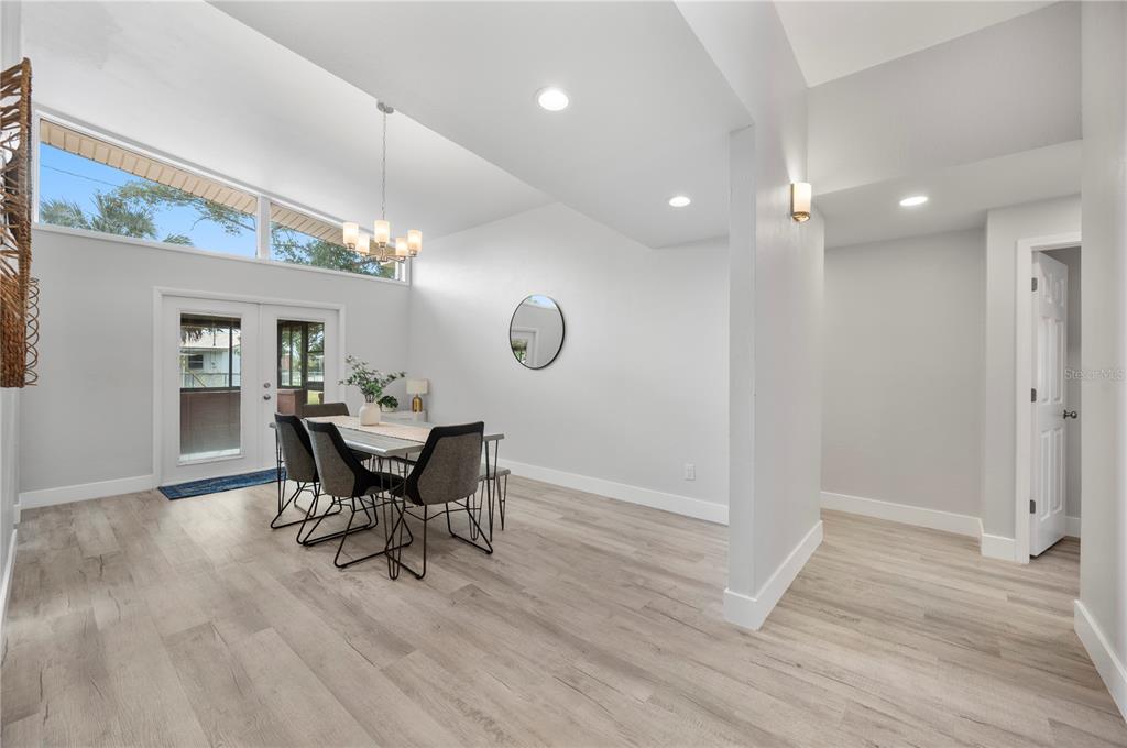 2214 Nottingham Road Lakeland, FL 33803 - Photo 14 of 40 a view of a dining room with furniture and wooden floor