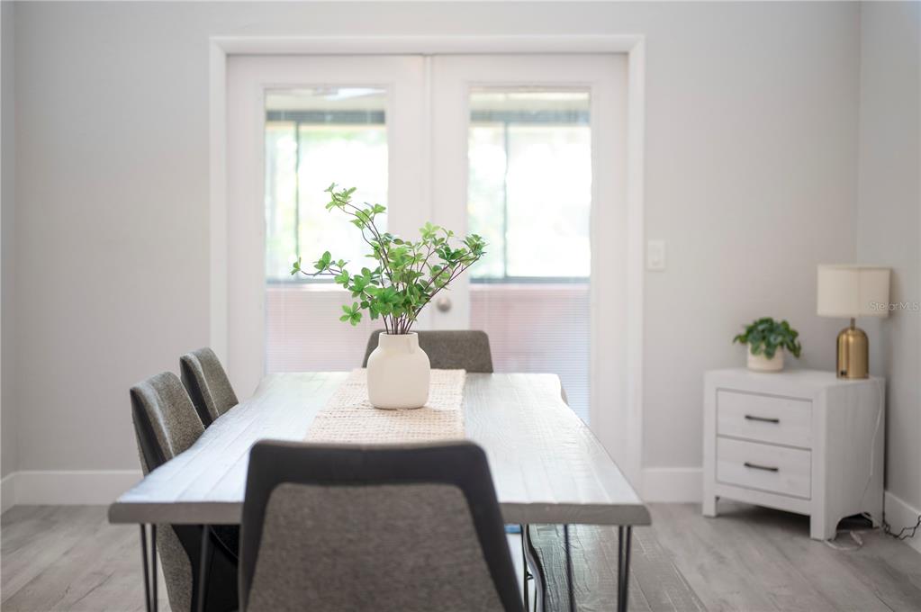 2214 Nottingham Road Lakeland, FL 33803 - Photo 17 of 40 a dining room with furniture and a potted plant