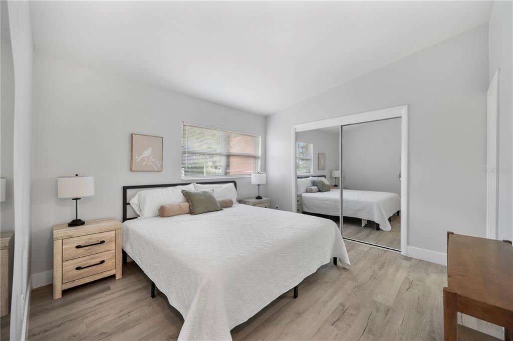 2214 Nottingham Road Lakeland, FL 33803 - Photo 18 of 40 a bedroom with a bed and a couch