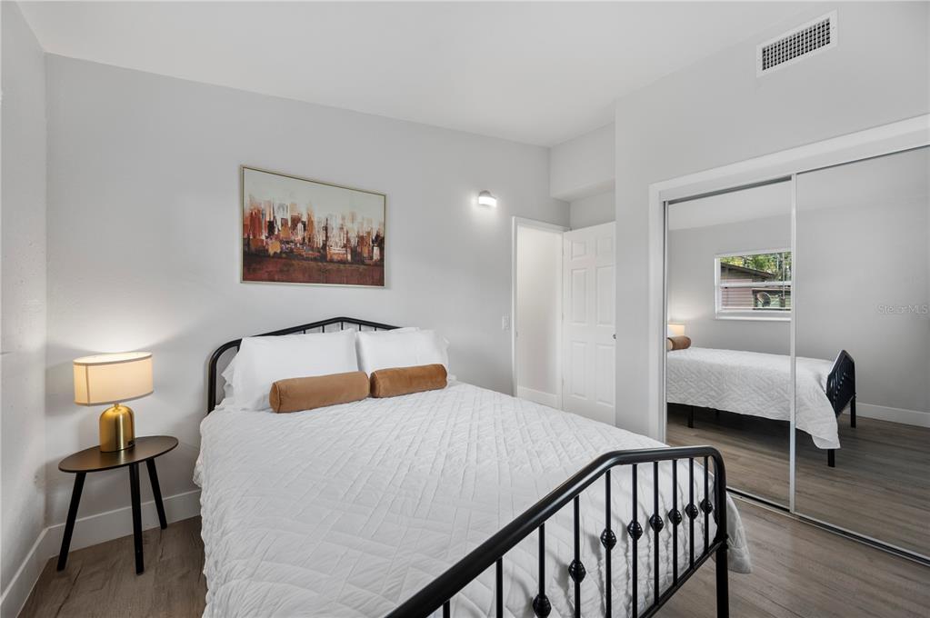 2214 Nottingham Road Lakeland, FL 33803 - Photo 23 of 40 a bedroom with a bed and wooden floor