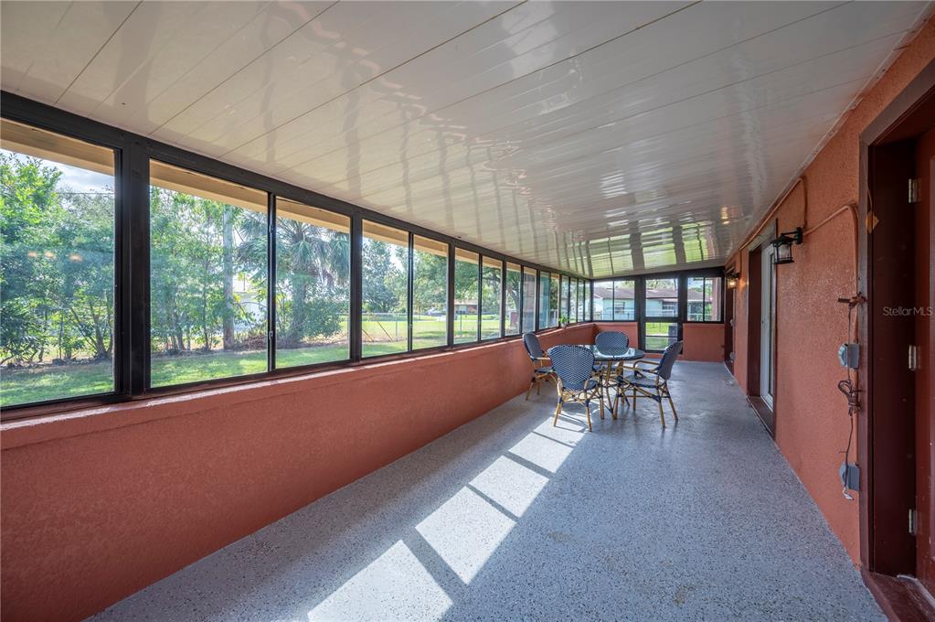 2214 Nottingham Road Lakeland, FL 33803 - Photo 32 of 40 a dining room with furniture and a garden