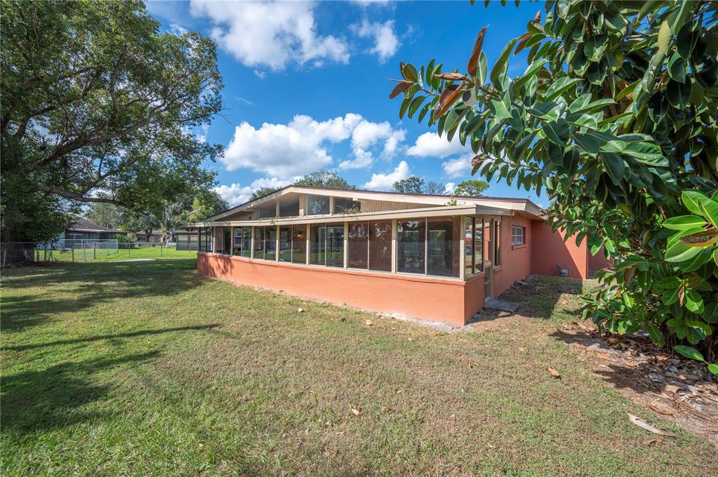 2214 Nottingham Road Lakeland, FL 33803 - Photo 40 of 40 a view of a house with a yard
