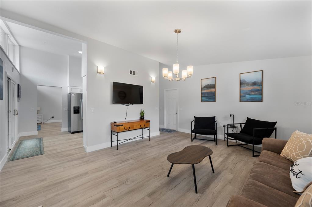 2214 Nottingham Road Lakeland, FL 33803 - Photo 5 of 40 a living room with furniture and a flat screen tv