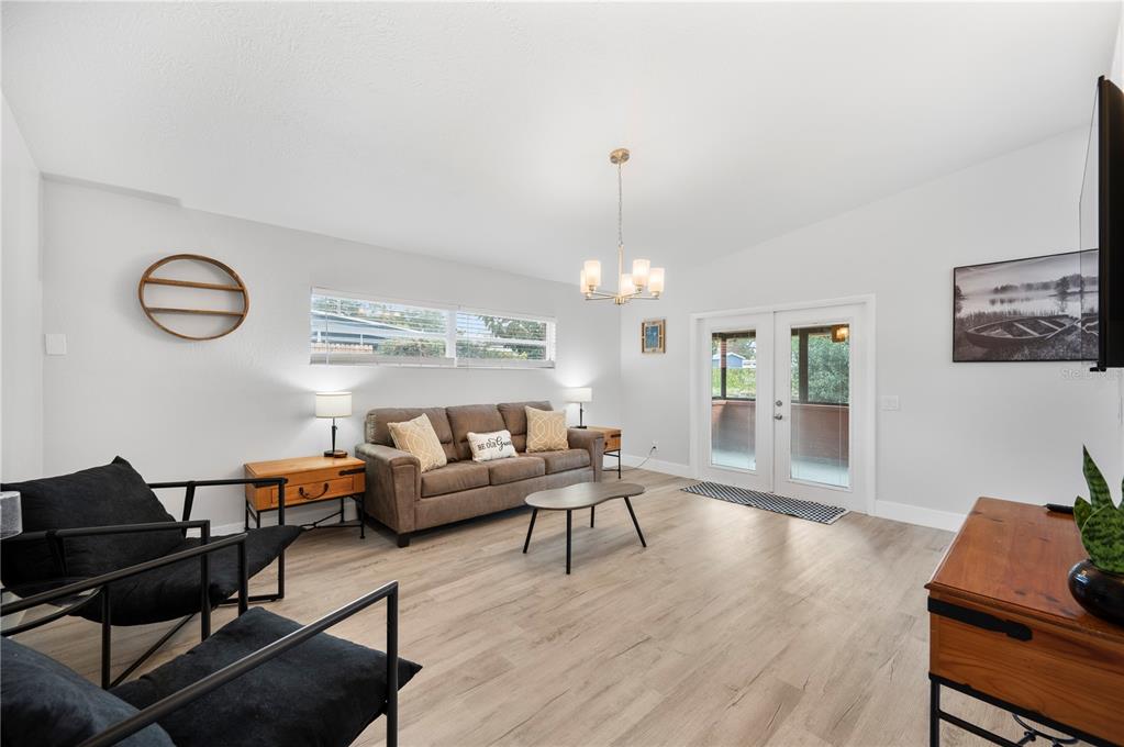 2214 Nottingham Road Lakeland, FL 33803 - Photo 7 of 40 a living room with furniture fireplace and wooden floor