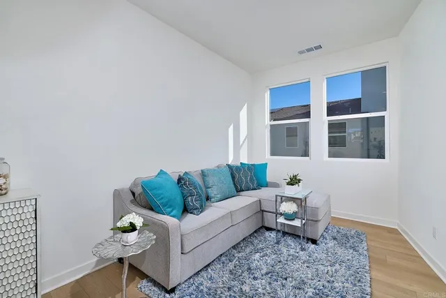 a living room with furniture and rug