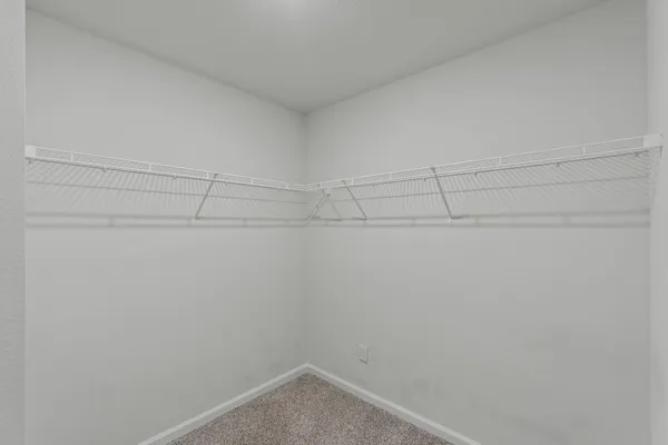 a view of a room with racks on the wall