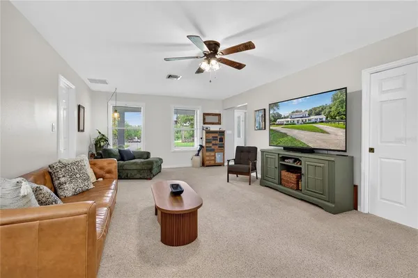 a dining room with furniture and a window