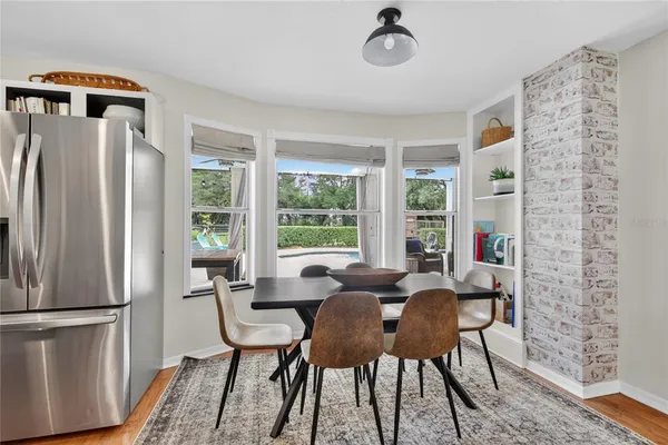 a kitchen with stainless steel appliances a refrigerator sink and stove