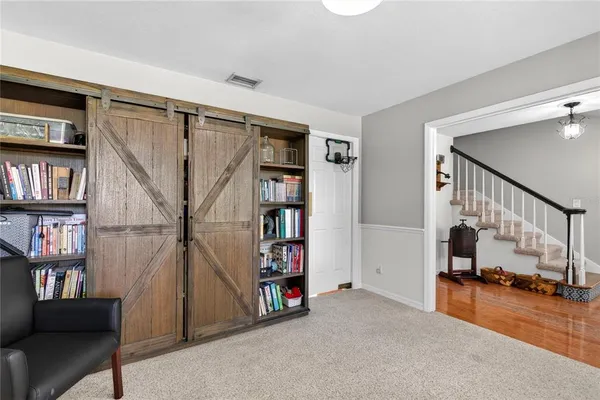 a view of a hallway with workspace and entryway