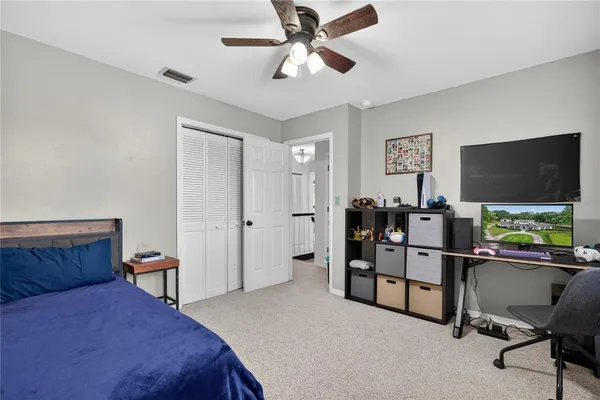 a view of a livingroom with furniture and a workspace
