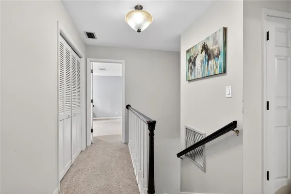 a bedroom with a bed and a view of en suite bathroom