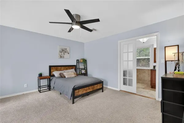 a bedroom with a bed and a cabinets
