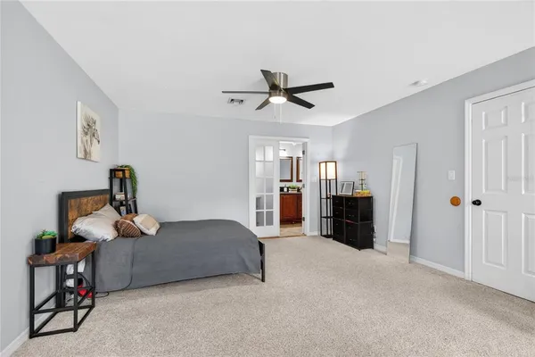 a bathroom with a double vanity sink mirror and shower