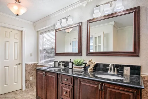 a bathroom with a mirror and a shower