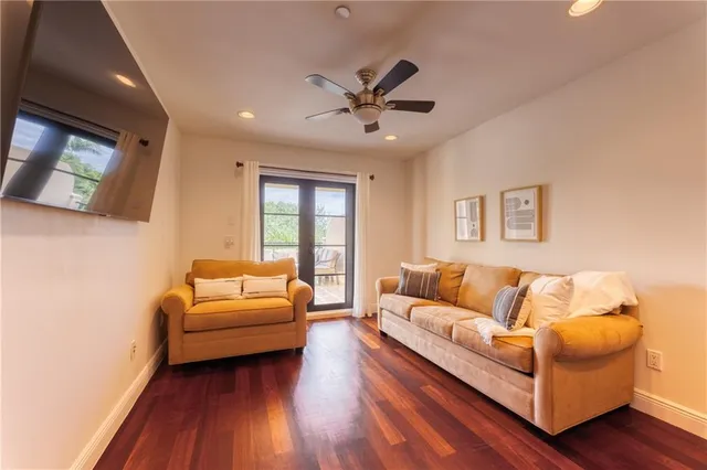 a view of a dining room with furniture and a chandelier