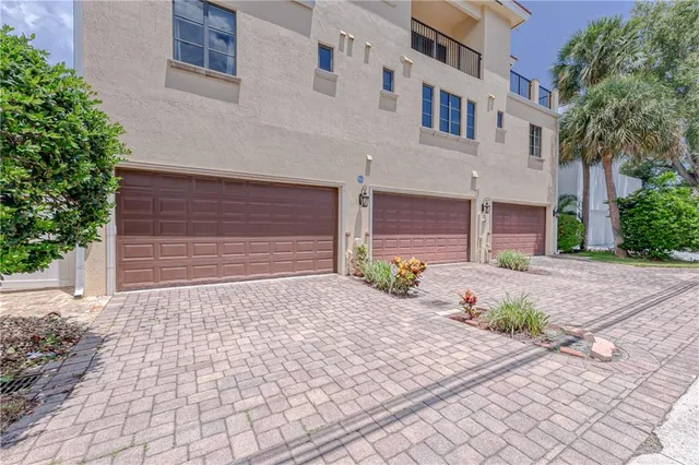 a view of a chair and tables in the balcony