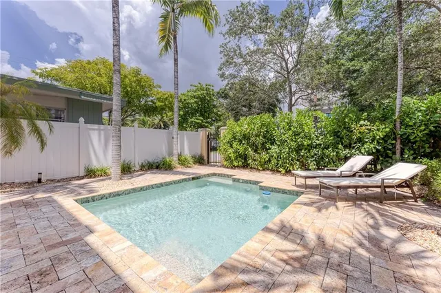 a view of a chairs and table in a patio
