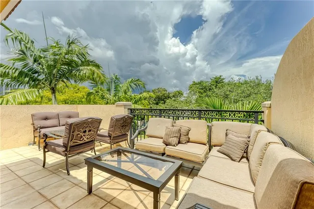 a view of a kitchen with a sink and cabinets
