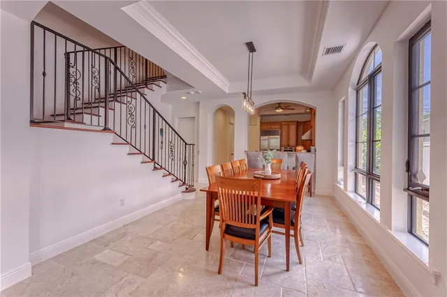 a view of a hallway with wooden floor and entryway