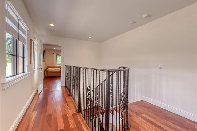 a bathroom with a granite countertop sink a toilet and shower
