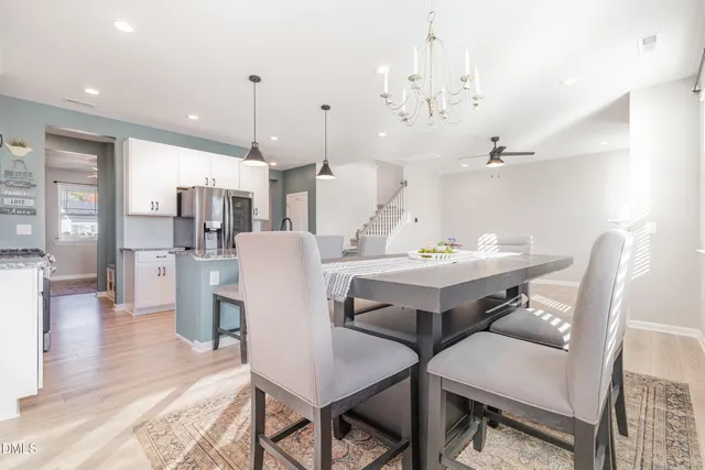 a view of a dining room with furniture and wooden floor