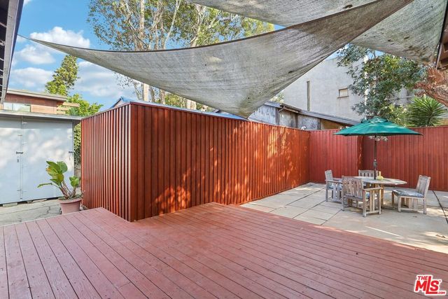 a view of a backyard of the house