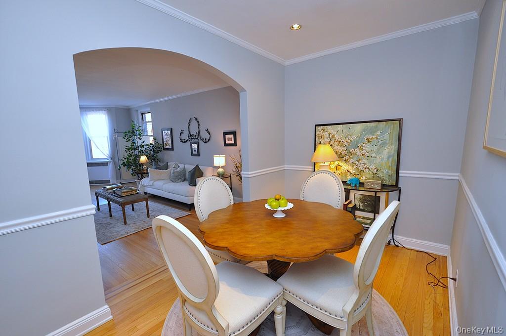 253 Garth Road, Unit 6J Scarsdale, NY 10583 - Photo 13 of 41 The dining room has an arched opening to the living room, chair rail and recessed lighting. The dining room is approx. 12'- 7'.